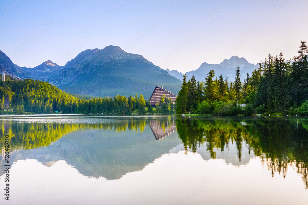 Breathtaking mountain views and a quiet lake.