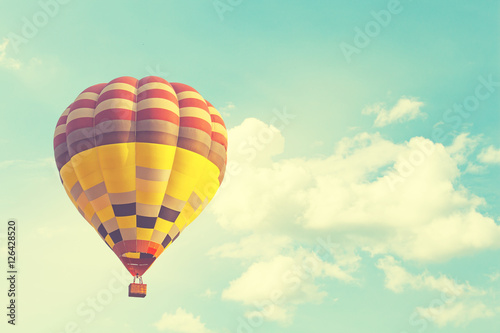 Hot air balloon on sun sky with cloud, vintage and retro instagram filter effect style © captainweeraphan