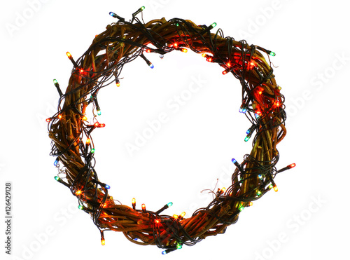 Winter holidays template card with copyspace isolated on white background. Wreath and garlands of colored light bulbs. Concept frame for shops label circle place for best price.