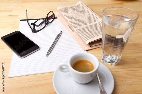 Cup of Coffee and Newspaper