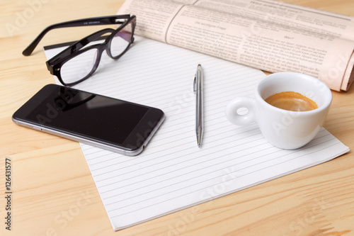 Cup of Coffee and Newspaper