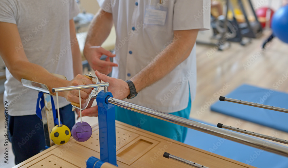 Obraz premium Hand therapy with physiotherapist
