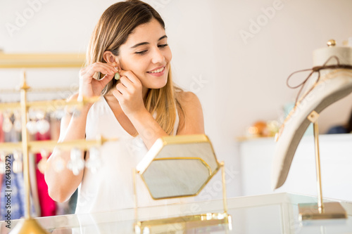 Happy woman buying some jewelry