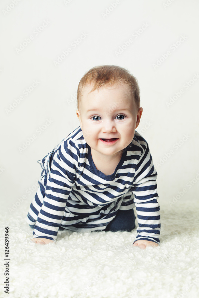 Cute Baby Girl. Small Child Wearing Striped T-Shirt Cute Baby Girl. Small Child Wearing Striped T-Shirt