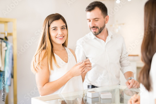 Happy woman buying a diamond ring