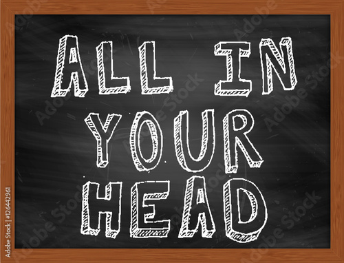 ALL IN YOUR HEAD handwritten text on black chalkboard