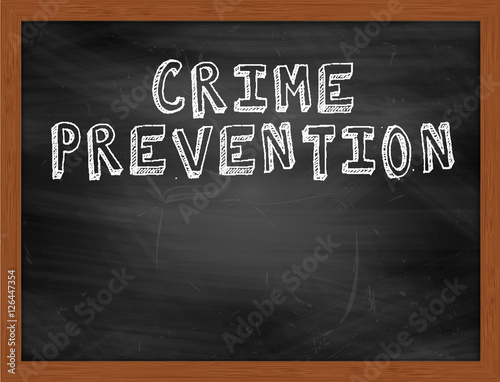 CRIME PREVENTION handwritten text on black chalkboard