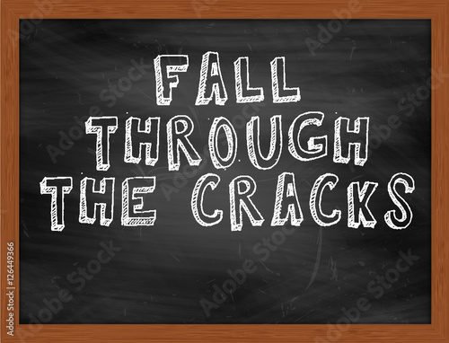 FALL THROUGH THE CRACKS handwritten text on black chalkboard