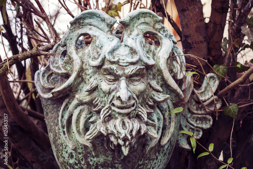 Fotografie, Obraz Satyr Woodland god face sculpture