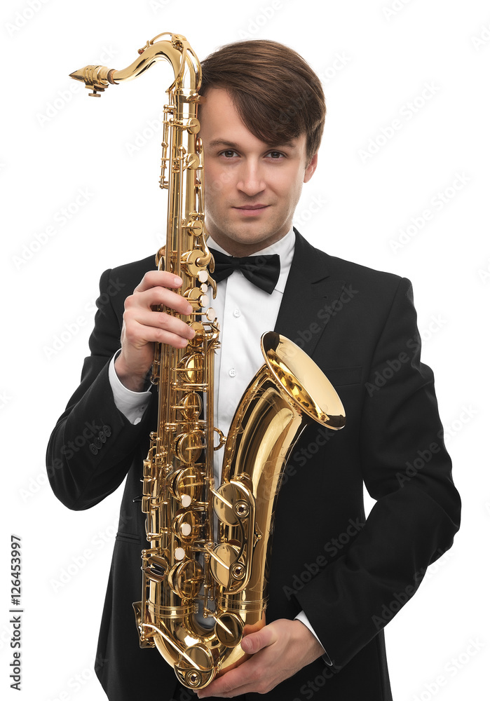 Naklejka premium Attractive saxophonist with a saxophone in suit.