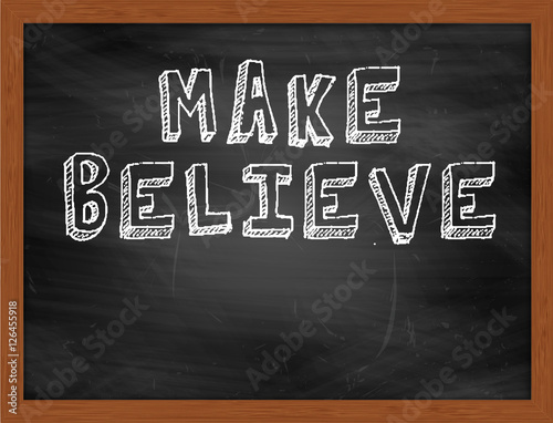 Fotografie MAKE BELIEVE handwritten text on black chalkboard