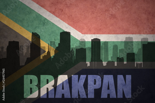abstract silhouette of the city with text Brakpan at the vintage south africa flag