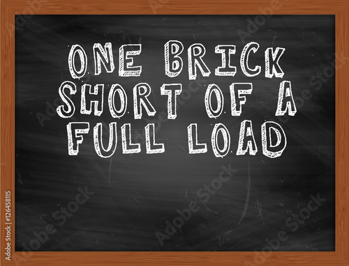 ONE BRICK SHORT OF A FULL LOAD handwritten text on black chalkbo