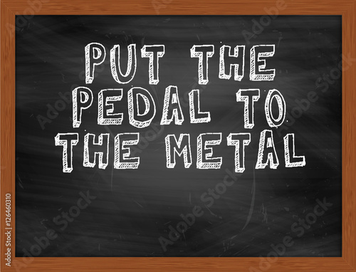 PUT THE PEDAL TO THE METAL handwritten text on black chalkboard