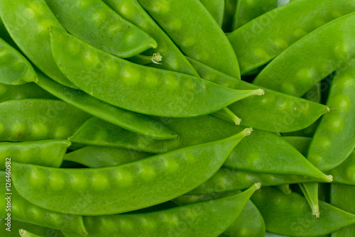 green snow pea pods background photo