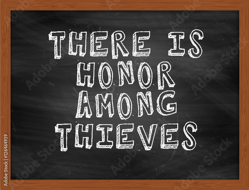 THERE IS HONOR AMONG THIEVES handwritten text on black chalkboar