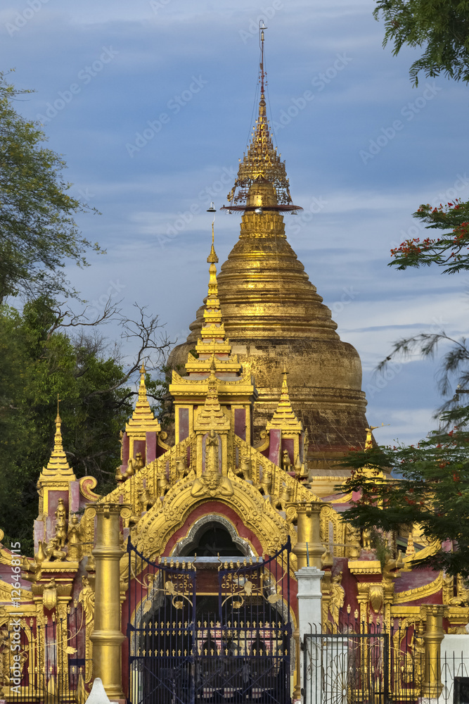 Entrance gate sunset view golden stupa, Kuthodaw Phaya Pagoda, Mandalay, Myanmar
