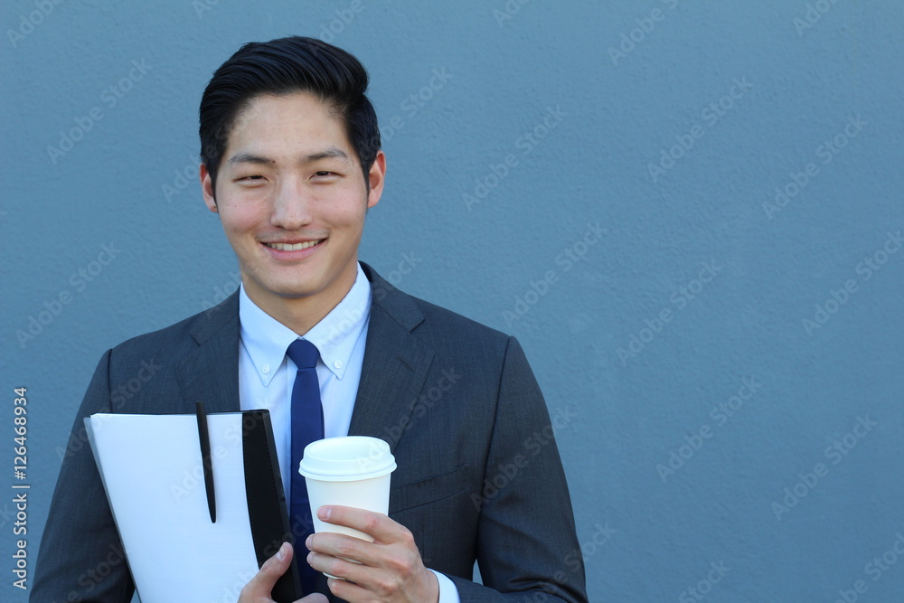 Asian Businessman Holding To Go Coffee Cup and Folder Asian Businessman Holding To Go Coffee Cup and Folder