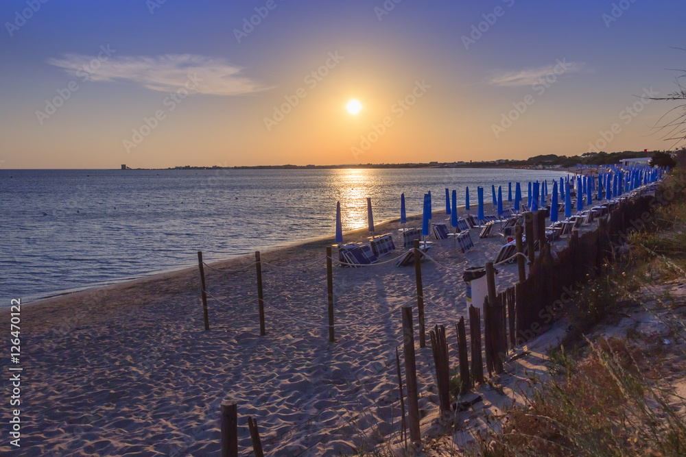 The most beautiful sandy beaches of Apulia.Salento coast: shoreline at sunset.Porto Cesareo skyline.ITALY (Lecce) The sandy coastline is characterized by dunes covered with Mediterranean maquis.
