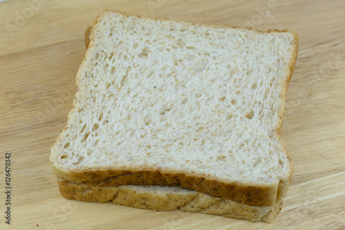 Bread whole wheat on wood background