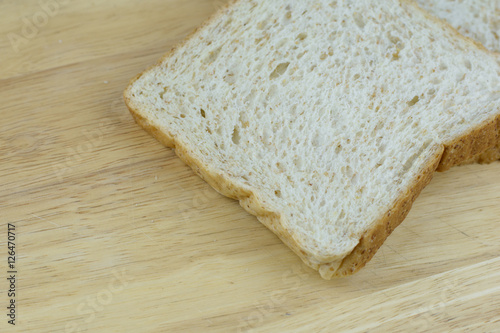 Bread whole wheat on wood background