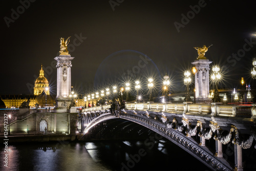 Pont Alexandre III Bridge illuminated at night in Paris, France © icephotography