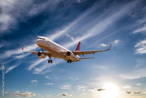 Fotografie Airplane with beautiful sky on background