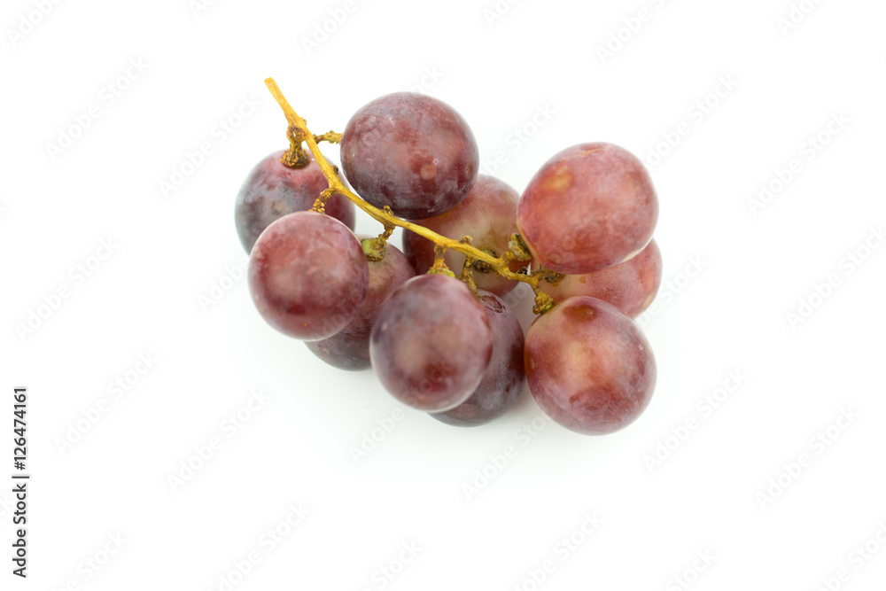 Ripe red grape with leaves isolated on white Ripe red grape with leaves isolated on white