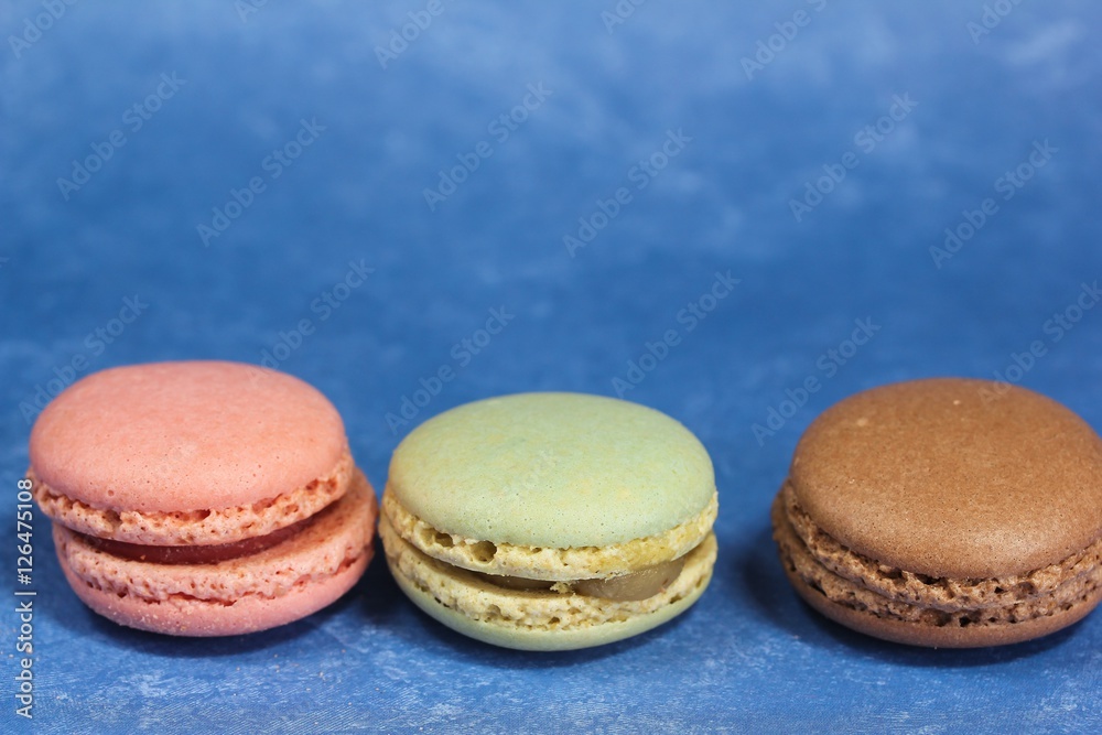 Macarons or macaroons on blue background Macarons or macaroons on blue background