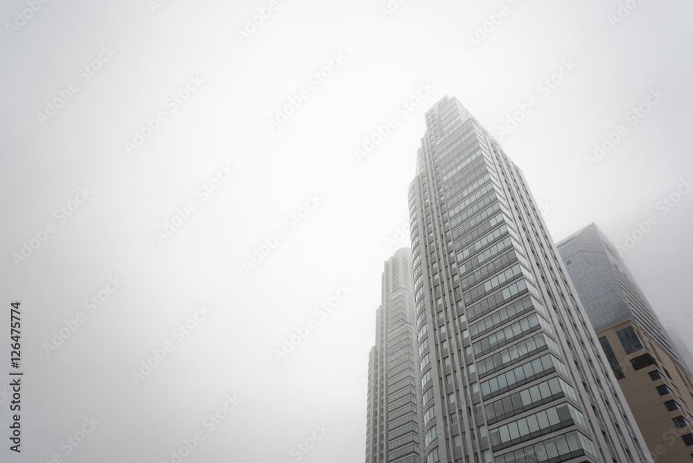Renoir Towers. Downtown skyscrapers under the fog upward view at the Puerto Madero.