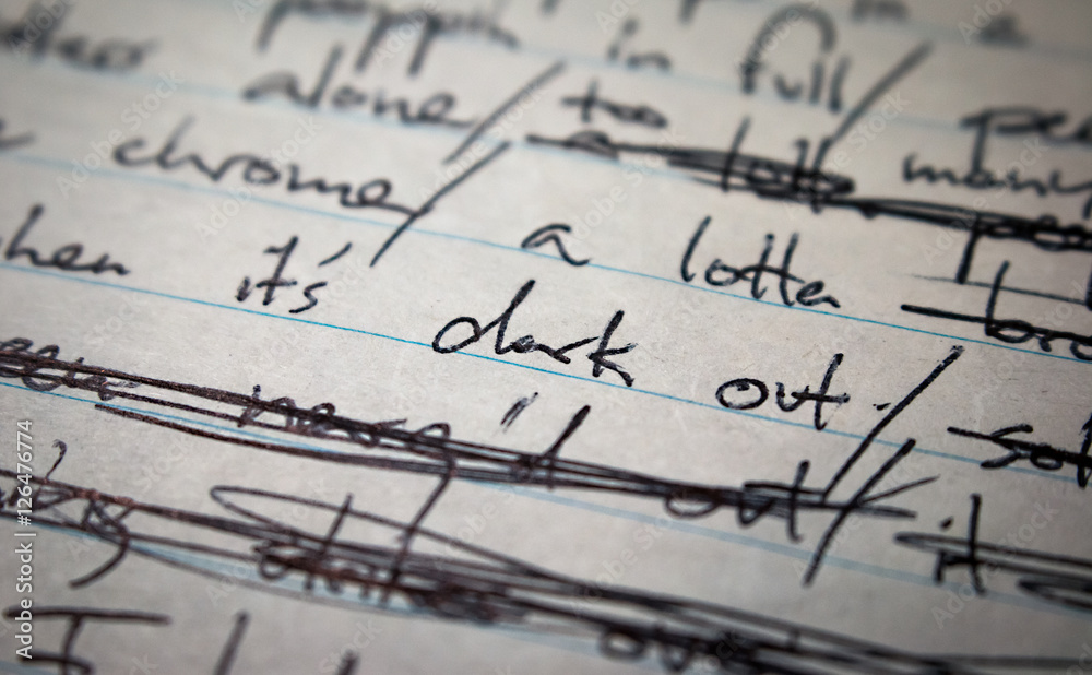 Fototapeta premium Lyrics written on paper in black ink close up. Focus on the words