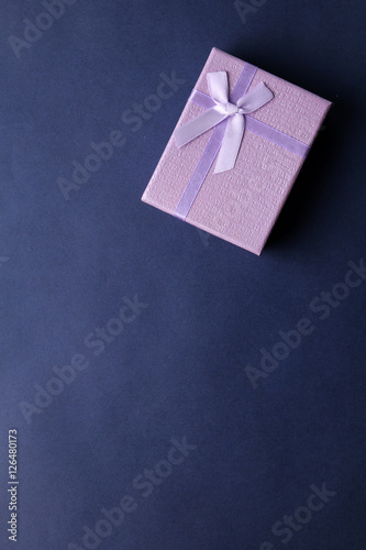 Purple present box on blue background © t4nkyong