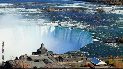 Niagara Falls with Table Rock Welcome Centre, a shopping and dining destination with tourist information on Canadian side in foreground photo