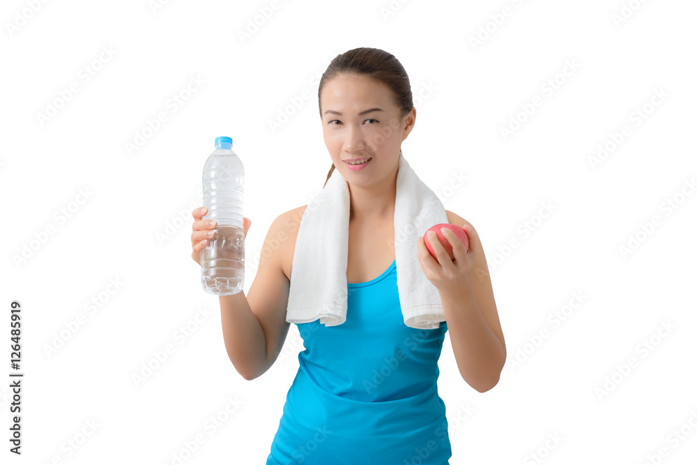 Fitness woman happy smiling holding apple and water bottle Fitness woman happy smiling holding apple and water bottle