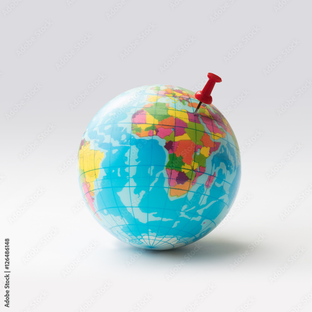 Fototapeta premium Red pin on globe, Isolated over white