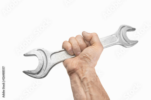 Human hand holding a  wrench photo