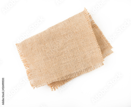 Burlap napkin isolated on white background. Top view.