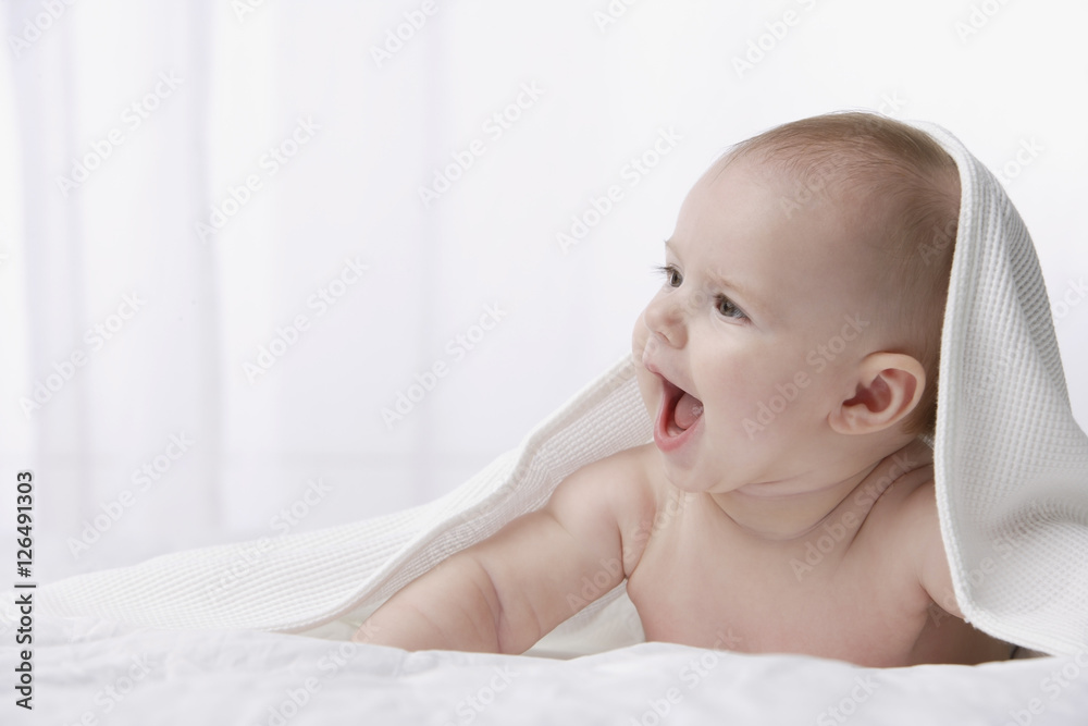 Profile of baby smiling