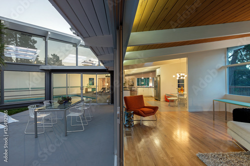 Inside - Outside view of a modern home at twilight.