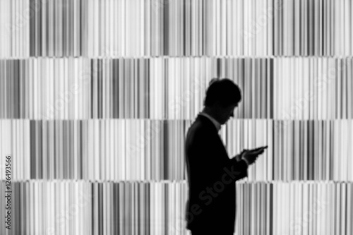 silhouette businessman using smart phone