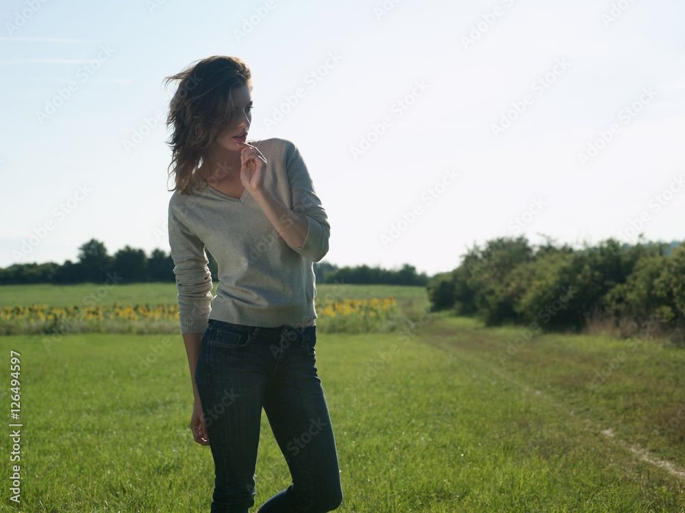 Young woman standing in field