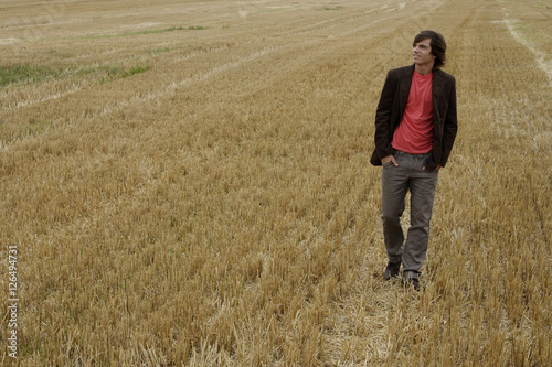 Young man standing in a field