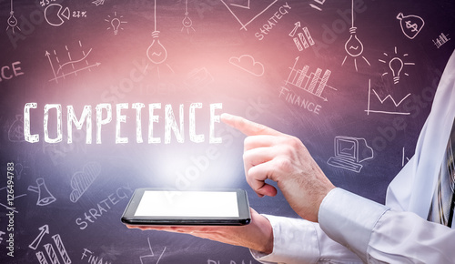 Quadro em tela Businessman is using tablet pc and selecting competence