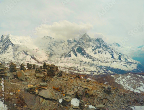 On snowy top of mountain in Himalaya, Nepal photo