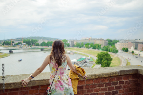 A stylish girl looking at the river