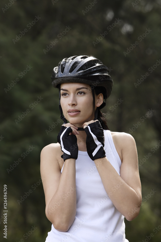 young woman wearing biking helmet young woman wearing biking helmet