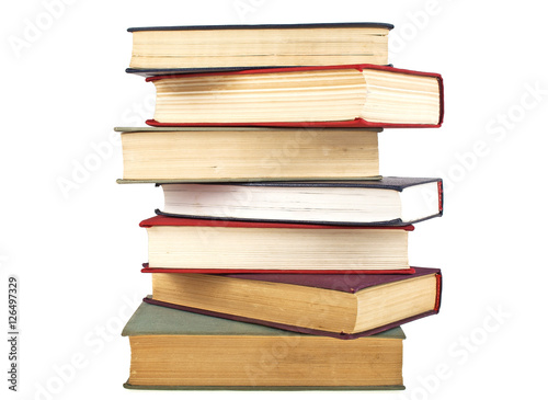 Stack of old books isolated on white background