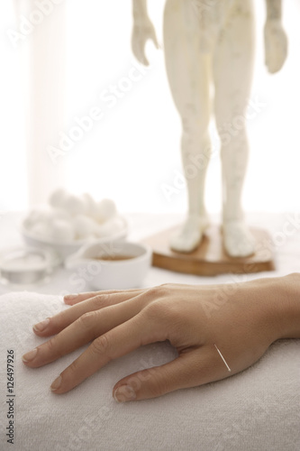acupuncture needle in woman's hand