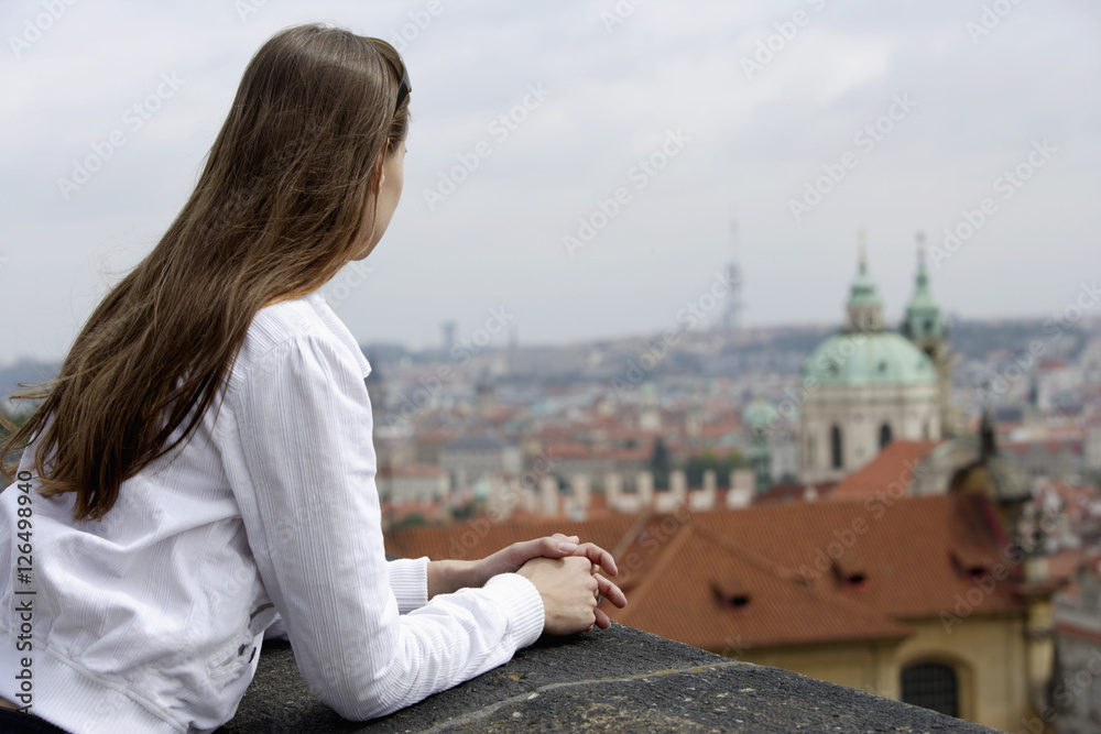 young woman looking at view of Prague