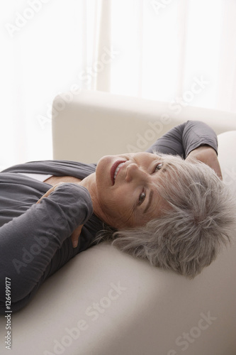 Older woman relaxing at home.